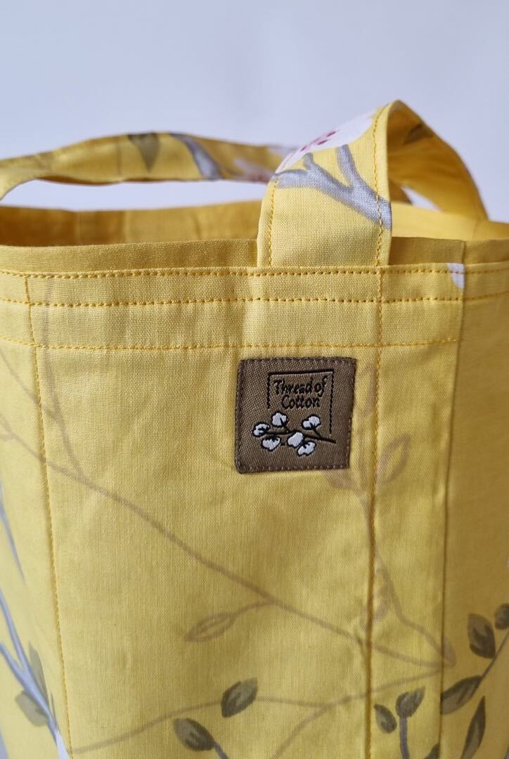 حقيبة قماشية بجيب امامي صفراء لترمس القهوة
